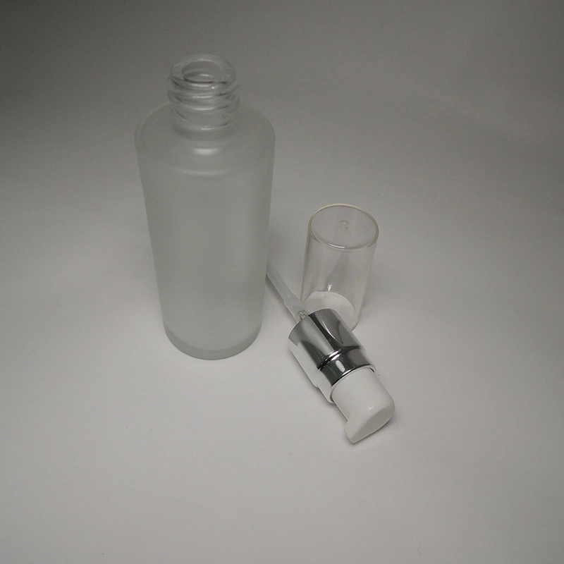 Medium Size Skincare Cosmetic Packaging Empty 50ml Cylinder Shape Glass Bottle Matte Finish with Cream/Lotion Pump and Oversize Cap